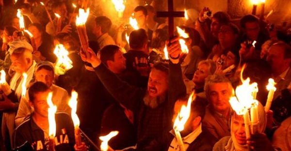 Pilgrims with the Holy Light at Pascal service - Jerusalem